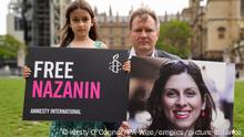 Nazanin Zaghari-Ratcliffe detained. File photo dated 23/09/21 pf Richard Ratcliffe and his daughter Gabriella holding signs in Parliament Square, London, to mark the 2,000th day Nazanin Zaghari-Ratcliffe had been detained in Iran. British-Iranian national Nazanin Zaghari-Ratcliffe has had her British passport returned, her MP Tulip Siddiq has said, adding that she understands there is a British negotiating team in Tehran where she is being detained. Issue date: Thursday September 23, 2021. See PA story POLITICS Iran. Photo credit should read: Kirsty O'Connor/PA Wire URN:65861736