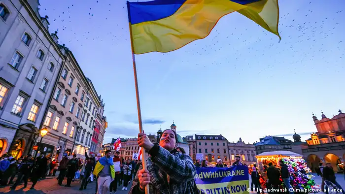 Krakow protesters wave the Ukrainian flag