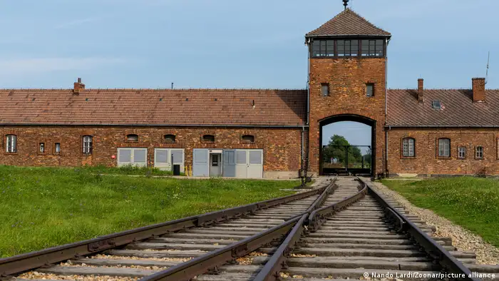 Remnants of Auschwitz-Birkenau camp, with train tracks visible 