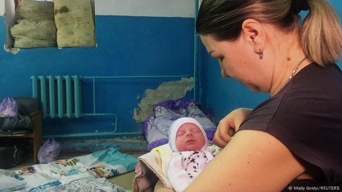 Ukraine |  Kharkiv |  Mother with child born in the basement of the maternity ward.