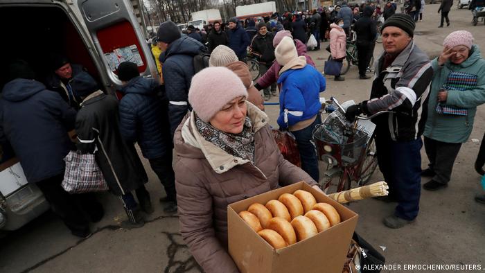 Locals are receiving humanitarian aid in the town of Volnovaka, which is controlled by pro-Russian separatists in the Donetsk region.