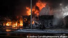 KHARKIV, UKRAINE - MARCH 16: Firefighters try to extinguish a fire broke out at the Saltivka construction market, hit by 6 rounds of Russian heavy artillery in Kharkiv, Ukraine on March 16, 2022. Andrea Carrubba / Anadolu Agency