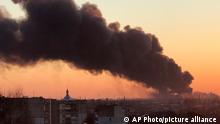 A cloud of smoke raises after an explosion in Lviv, western Ukraine, Friday, March 18, 2022. The mayor of Lviv says missiles struck near the city's airport early Friday. (AP Photo)