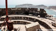 A picture shows a view of the Sira Fortress overlooking Yemen's southern port of Aden, on February 24, 2022. - Yemen's brutal war has not just killed hundreds of thousands but also laid waste to much of its rich architectural heritage, from its iconic mud brick towers to mosques, churches, museums and military bastions. Among those is the Sira Fortress, which withstood attacks by the Portuguese and the Turks, but years of war have left the 11th century citadel in disrepair, defaced by graffiti and littered with rubbish. (Photo by Saleh Al-OBEIDI / AFP)