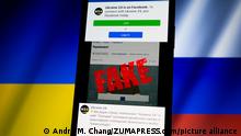 March 17, 2022, Asuncion, Paraguay: Illustration: Ukraine 24 Facebook page is displayed on a smartphone backdropped by cropped waving flags of Ukraine and Russia. Ukraine 24 posted a warning on Facebook that its broadcast and website were hacked on Wednesday. A fake video depicting Ukrainian President Volodymyr Zelenskyy circulated on social media and was placed on Ukraine 24 website by hackers before it was debunked and removed. (Credit Image: Â© Andre M. Chang/ZUMA Press Wire
