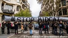 December 12, 2017 - Barcelona, Catalonia, Spain - Several activists seen showing an inflatable globe with the text ''STOP MIDCAT'' a catalan gas pipeline..Coinciding with the Summit in Paris, One Planet, organized by Emmanuel Macron, a small group of activists have been concentrated outside the headquarters of the European Union in Barcelona to demand the abandonment of investments in non-sustainable energy. Together with the World Bank (WB), other financial institutions and investment funds have announced at the Summit One Planet that they will not fund, except in the exceptional situation of poor countries, projects of exploration and extraction of oil and gas, in favor of the Green and renewable energy economy