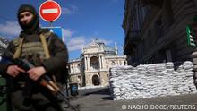 Ukrainian service members patrol in front of the National Academic Theatre of Opera and Ballet, as Russia's invasion of Ukraine continues, in downtown Odessa, Ukraine, March 17, 2022. REUTERS/Nacho Doce