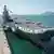 Shandong aircraft carrier at a naval port