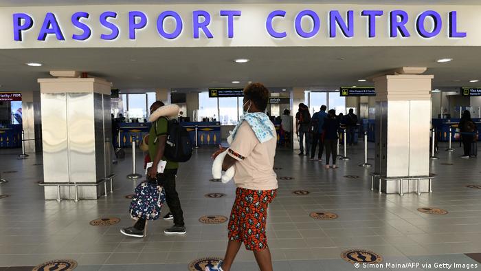 Passengers arrive at the Passport control section at Jomo Kenyatta international airport in Nairobi