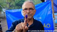 East Timorese presidential candidate who is also former President Jose Ramos-Horta shows his inked finger after casting his ballot at a polling station during the election in Dili, East Timor, Saturday, March 19, 2022. Nearly a million people in East Timor were voting for president on Saturday in an election that will test the young nation's stability amid a protracted political crisis and economic uncertainty. (AP Photo/Lorenio Do Rosario Pereira)