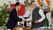 Indian Prime Minister Narendra Modi shakes hand with his Japanese counterpart Fumio Kishida during a signing of agreements in New Delhi, Saturday, March 19, 2022. Kishida is meeting with Modi to strengthen their partnership in the Indo-Pacific and beyond in view of China’s growing footprint in the region, an Indian official said Thursday. (AP Photo/Manish Swarup)