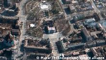 This satellite image provided by Maxar Technologies on Saturday, March 19, 2022 shows the aftermath of the airstrike on the Mariupol Drama theater, Ukraine, and the area around it. (Satellite image ©2022 Maxar Technologies via AP