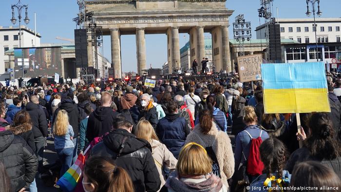 People gather in front of the Brandenburg Gate for the solidarity rally Sound of Peace. Several well-known artists were set to perform and express their support for Ukraine 