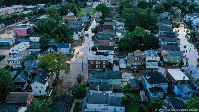 An aerial view of a community in Manville as flood water covers streets