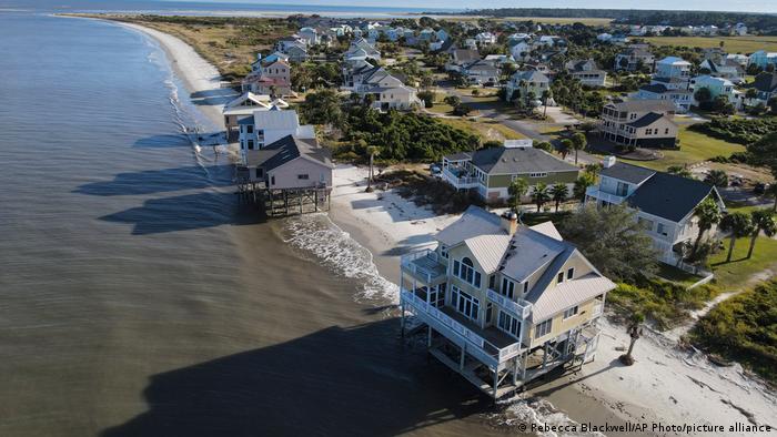 Water laps the bottom level of four homes in Harbor Island, South Carolina