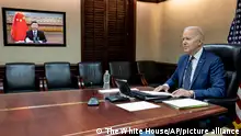 In this image provided by the White House, President Joe Biden meets virtually from the Situation Room at the White House with China’s Xi Jinping, Friday, March 18, 2022, in Washington. (The White House via AP)