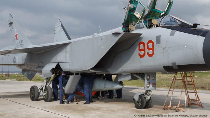 Fighter jet carrying a Kinzhal hypersonic missile at an airbase