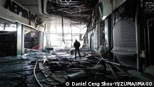 March 21, 2022, Kyiv, Kyiv, Ukraine: A man is seen inside a damaged shopping mall in Podilskyi district of Kyiv by the Russian air strikes, amid Russian invasion. Local media have reported that the attack has caused 4 deaths. Kyiv Ukraine - ZUMAs313 20220321_zip_s313_001 Copyright: xDanielxCengxShou-Yix 