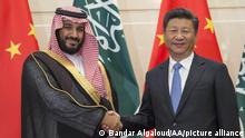 BEIJING, CHINA - AUGUST 31 : Saudi Defence Minister and Deputy Crown Prince Mohammed bin Salman (L) and Chinese President Xi Jinping (R) shake hands as they pose for photo during their meeting in Beijing, China on August 31, 2016. Pool / Bandar Algaloud / Anadolu Agency
