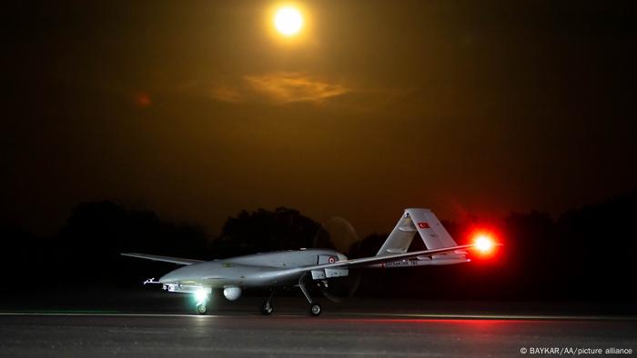 A Turkish Bayraktar TB2 drone seen on a runway at night