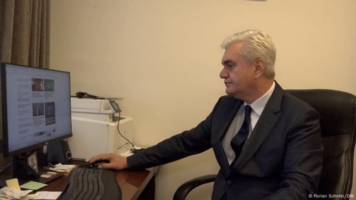 Vadym Sabluk working at his desk, looking at a computer screen