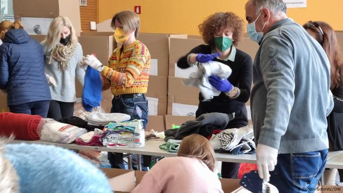 Volunteers bundle up aid packages for Ukraine