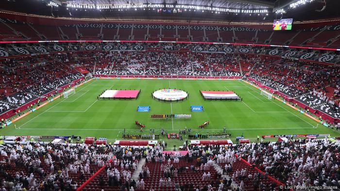 A wide view of both teams in the stadium as Qatar take on Iraq in Qatar.