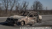 ZAPORIZHZHIA, UKRAINE - MARCH 22: A destroyed vehicle is seen after Russian attack on a humanitarian convoy fleeing Mariupol to about 20 km from the city of Zaporizhzhia, Ukraine on March 22, 2022. Andrea Carrubba / Anadolu Agency