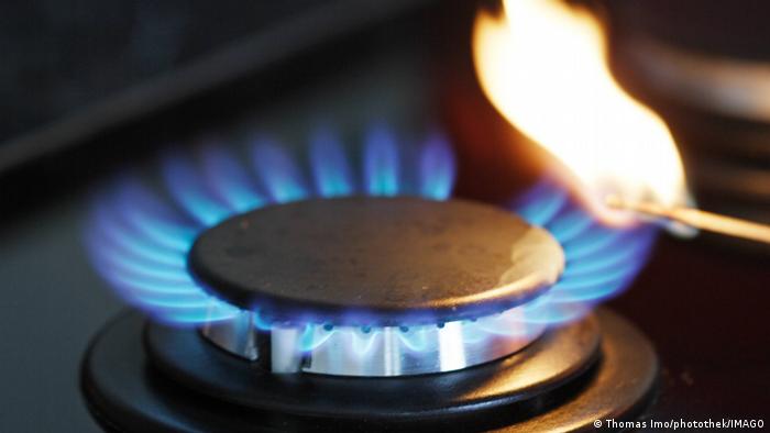 A blue flame on a gas stove