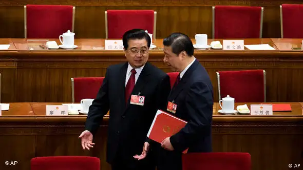 FILE - In this March 13, 2009 file photo, Chinese President Hu Jintao, left, chats with Vice President Xi Jinping as they leave the Great Hall of the People after the closing ceremony of the National People's Congress in Beijing, China. Chinese Vice President Xi has been promoted to vice chairman of a key Communist Party military committee, state media reported Monday, Oct. 18, 2010, in the clearest sign yet he is on track to be the country's future leader. (AP Photo/Andy Wong, File)