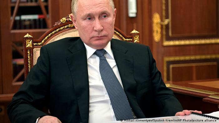Russian President Vladimir Putin listens during a meeting in Moscow
