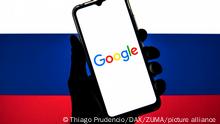 March 11, 2022, Barcelona, Catalonia: In this photo illustration a Google logo seen displayed on a smartphone with a flag of the Russia in the background. (Credit Image: Â© Thiago Prudencio/DAX via ZUMA Press Wire