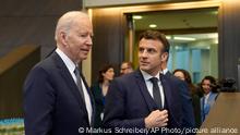 U.S. President Joe Biden, left, speaks with French President Emmanuel Macron prior to a round table meeting during an extraordinary NATO summit at NATO headquarters in Brussels, Thursday, March 24, 2022. As the war in Ukraine grinds into a second month, President Joe Biden and Western allies are gathering to chart a path to ramp up pressure on Russian President Vladimir Putin while tending to the economic and security fallout that's spreading across Europe and the world. (AP Photo/Markus Schreiber)