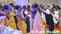 People line dancing at a wedding in Uganda