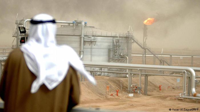 A man overlooks an oil field in Kuwait