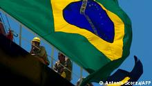 2010****A Brazilian national flag flutters during the launching ceremony -- attended by President Luiz Inacio Lula da Silva -- of Petrobras' Transpetro oil tanker Sergio Buarque de Holanda, at the Maua shipyard in Niteroi, Brazil, on November 19, 2010. The Brazilian naval industry had a rebirth during Lula de Silva's administration with its Program for Modernization and Expansion of the Fleet (PROMEF) - part of the federal government's Growth Acceleration Program (GAP). AFP PHOTO/ANTONIO SCORZA (Photo by ANTONIO SCORZA / AFP)
