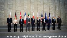 From left, NATO Secretary General Jens Stoltenberg, European Commission President Ursula von der Leyen, Japan Prime Minister Fumio Kishida, Canadian Prime Minister Justin Trudeau, U.S. President Joe Biden, German Chancellor Olaf Scholz, British Prime Minister Boris Johnson, French President Emmanuel Macron, Italian Prime Minister Mario Draghi and European Council President Charles Michel pose during a photo of the Group of Seven (G7) prior to a meeting at NATO Headquarters in Brussels, Belgium on Thursday, March 24, 2022. (Sean Kilpatrick/The Canadian Press via AP)