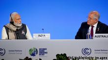 GLASGOW, SCOTLAND - NOVEMBER 02: Indian Prime Minister Narendra Modi (L) and Australian Prime Minister Scott Morrison attend a meeting on day three of COP26 at SECC on November 2, 2021 in Glasgow, Scotland. 2021 sees the 26th United Nations Climate Change Conference. The conference will run from 31 October for two weeks, finishing on 12 November. It was meant to take place in 2020 but was delayed due to the Covid-19 pandemic. (Photo by Phil Noble - Pool/Getty Images)