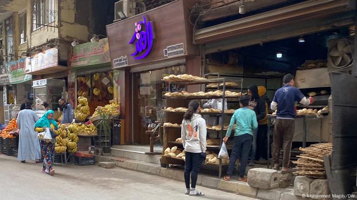 Customers queuing outside a bakery in Cairo 