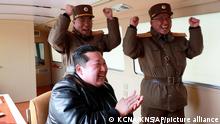 In this photo distributed by the North Korean government, North Korean leader Kim Jong Un, front, claps during a test-fire of what it says a Hwasong-17 intercontinental ballistic missile (ICBM), at an undisclosed location in North Korea on March 24, 2022. Independent journalists were not given access to cover the event depicted in this image distributed by the North Korean government. The content of this image is as provided and cannot be independently verified. Korean language watermark on image as provided by source reads: KCNA which is the abbreviation for Korean Central News Agency. (Korean Central News Agency/Korea News Service via AP)