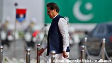 Pakistan's Prime Minister Imran Khan arrives to attend a military parade to mark Pakistan National Day in Islamabad, Pakistan, Wednesday, March 23, 2022. Pakistanis celebrated their National Day on Wednesday with a military parade in the capital, Islamabad, showcasing this Islamic nation's elite army units and high-tech weaponry, including short, medium, and long-range missiles, tanks, fighter jets and other hardware. (Anjum Naveed)