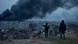 People watch as smoke rises after an airstrike, as Russia's attack on Ukraine continues, in Lviv People watch as smoke rises after an airstrike, as Russia's attack on Ukraine continues, in Lviv