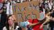 A protest in New York, the US, calling for increased taxation on the rich A protest in New York, the US, calling for increased taxation on the rich