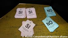 Ballot papers sit on a bench at a polling station during a referendum on whether to remove some of the articles in the Law of Urgent Consideration, know as LUC, in Montevideo, Uruguay, Sunday, March 27, 2022. The articles up for consideration have to do with security, education, fiscal management, and public companies. (AP Photo/Matilde Campodonico)