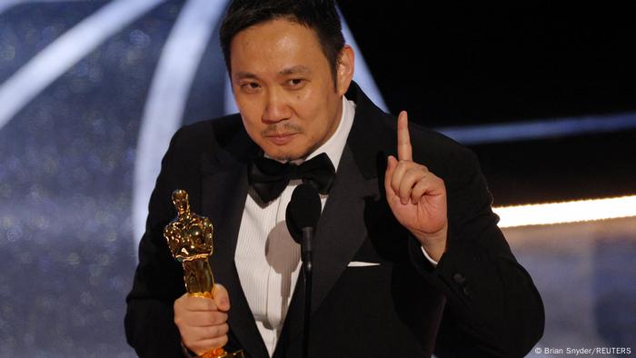Director Ryusuke Hamaguchi accepts the Oscar for Best International Feature Film