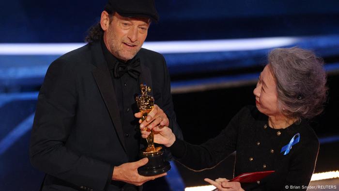 Troy Kotsur accepts the Oscar for Best Supporting Actor