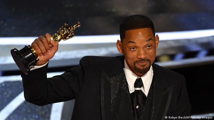 Will Smith holds up an Oscar