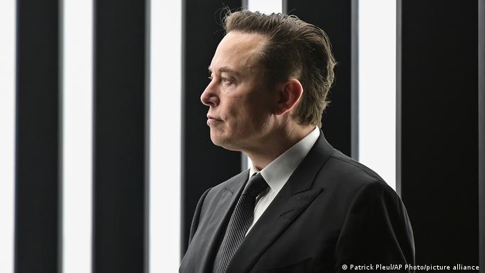 Elon Musk in profile at the opening of a Tesla factory in Germany.
