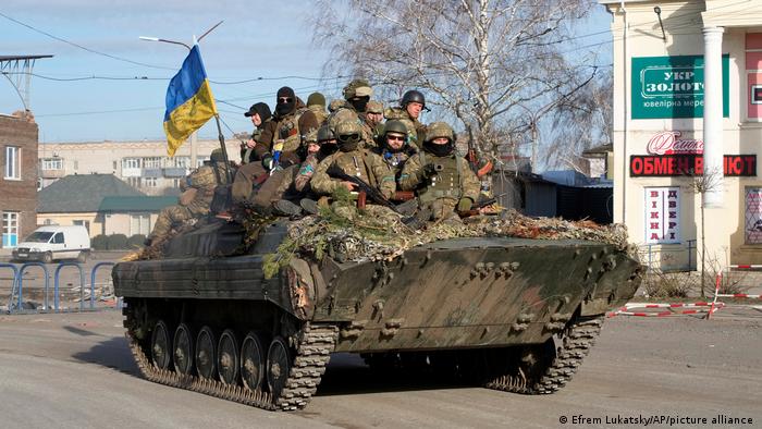 Ukrainian soldiers ride a tank through the town of Trostsyanets, some 400 km eastern of capital Kyiv, Ukraine, Monday, March 28, 2022 (AP Photo/Efrem Lukatsky)