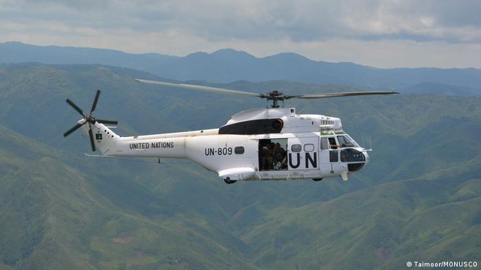 A UN helicopter flies above hills in eastern DR Congo